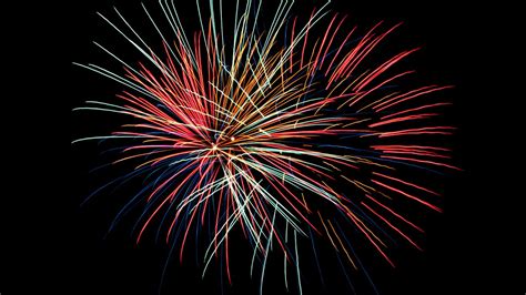 Download Wallpaper 1366x768 Fireworks Sparks Darkness Holiday Tablet