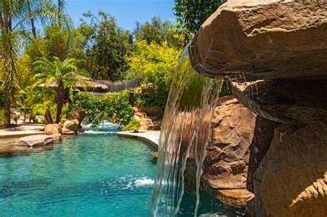 Tropical Pool With Soothing Waterfall Hgtv