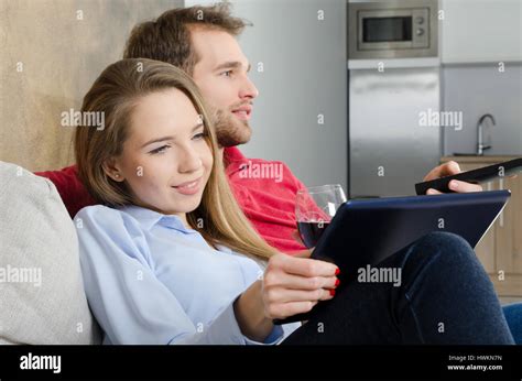 Couple Enjoys Free Time And Watching Tv Couple Watching Movie Home Fun