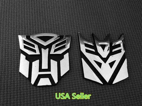 Save up to 15% when you buy more. Large 3D Autobot Decepticon Transformers Emblem Badge ...