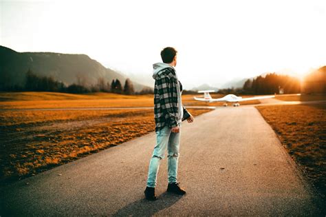 Photography Of A Man Wearing Gray Jacket Looking Back · Free Stock Photo