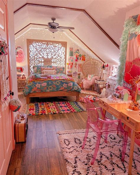 An Attic Bedroom Decorated In Pink And Green With Lots Of Decorations