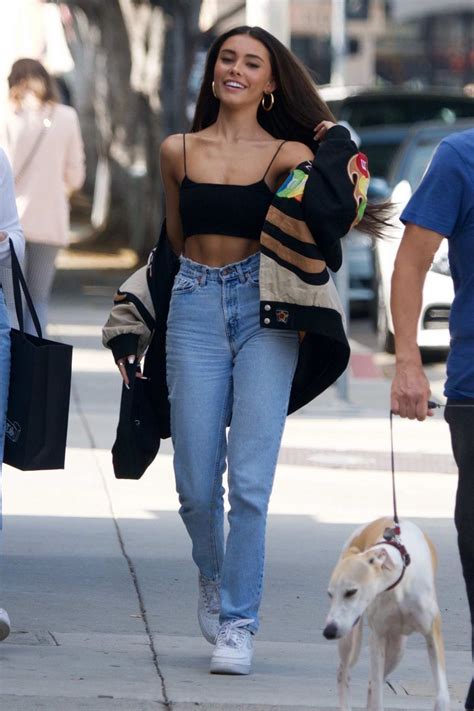 Madison Beer Shows Off Her Taut Tummy In A Black Crop Top While