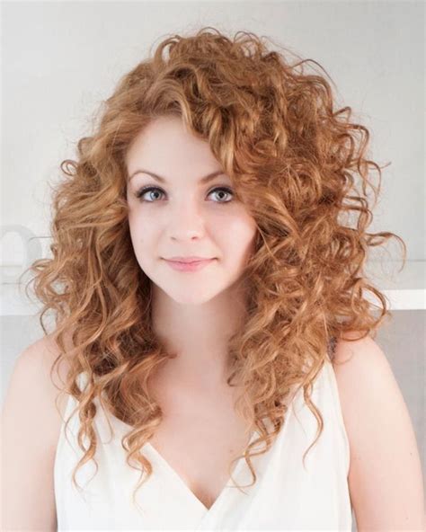 Strawberry Blonde Woman With Medium Long Hair Curly With Side Part Wearing A Whi Long
