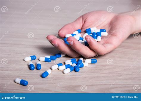 Overdose Concept Hand With Pills On The Floor Stock Image Image Of