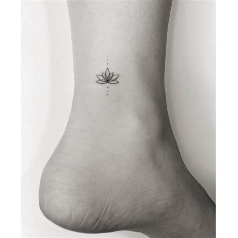 Fine Line Lotus Flower Tattoo Placed On The Ankle