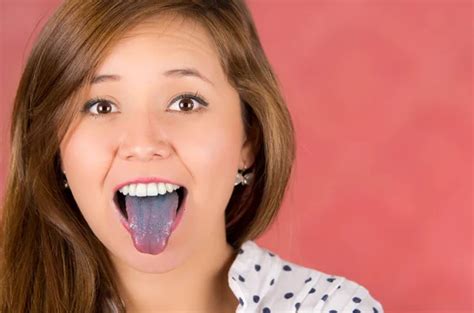woman with open mouth spreading tongue colored in blue with pink background with colored nails
