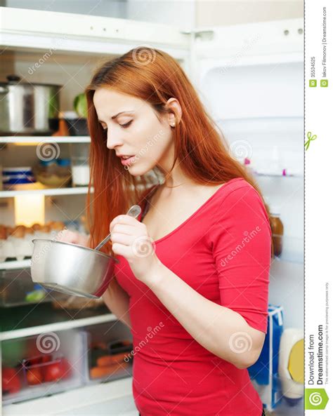 Hungry Woman Looking In To Pan Royalty Free Stock Photo Image