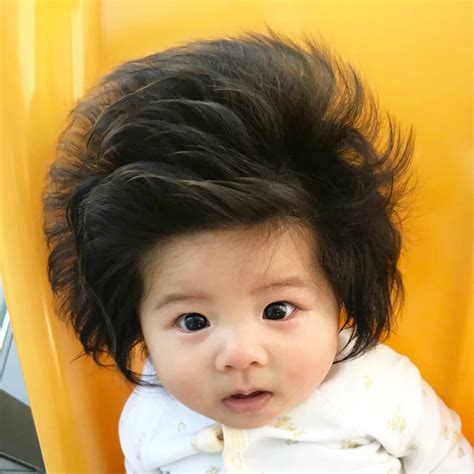 Arthur's hair is so long it gets in his eyescredit: This Seven-Month-Old Baby Has A Full Head of Thick Hair