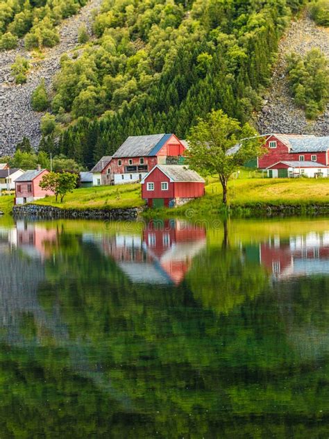 Norwegian Country Houses In The Mountains On Lake Shore Stock Photo
