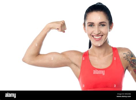 Smiling Young Fit Gym Woman Flexing Her Muscles Stock Photo Alamy