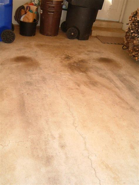 Scrape off the excess so repairs are flush with the surrounding floor. How To: Repair cracks in a concrete garage floor before ...