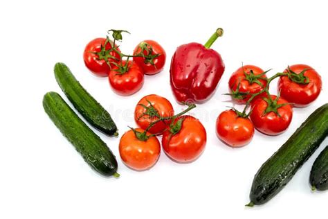 Large Green Cucumbers One Red Bell Pepper Red Tomatoes On A Green