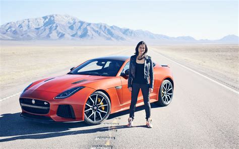 1680x1050 Michelle Rodriguez With Jaguar F Type 1680x1050 Resolution Hd