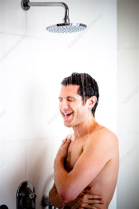 Man Taking Shower Stock Image C Science Photo Library