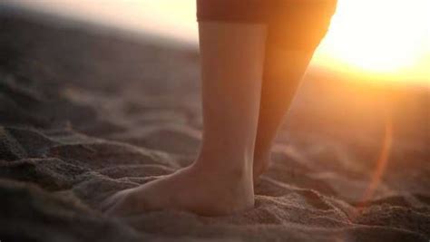 Close Up Of Bare Feet On Sandy Beach At Sunset Stock Video Footage