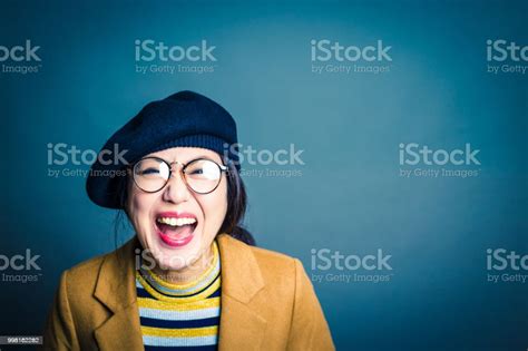Laughing Asian Womans Studio Portrait Stock Photo Download Image Now Years Adult