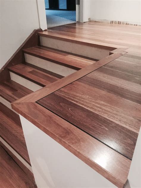 Where can i buy prefab stairs in australia? Spotted gum floating floor with white stair risers. Custom ...