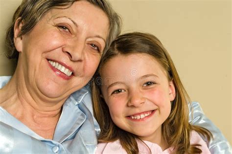 Smiling Grandmother And Granddaughter Stock Photo Image Of Female