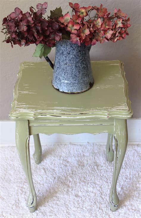 This Small Sage Green Table Has Been Distressed To Give It Character