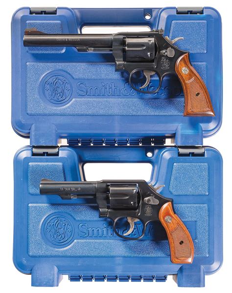 Two Smith And Wesson Da Revolvers W Cases