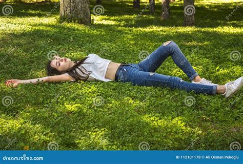 Relaxing Girl In Bloom Garden Royalty Free Stock Photography