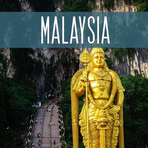 A Golden Statue With The Words Malaysia Over It