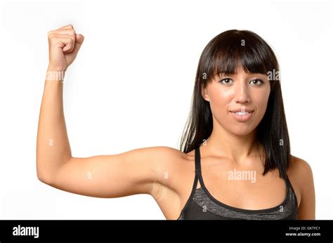 Attractive Friendly Young Woman Flexing Her Bare Arm To Show Her Biceps