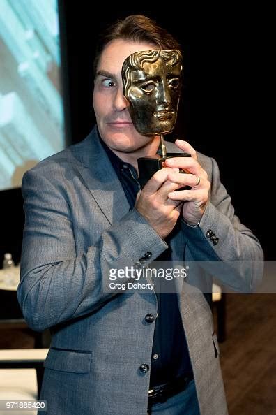 Nolan North Displays His Statue As Bafta Honors Nolan North With A News Photo Getty Images