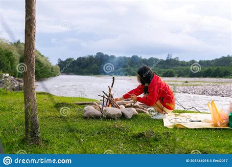 Female Brunette Woman Makes Camp Fire Stock Photo Image Of Holiday