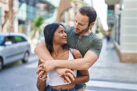 Man And Woman Interracial Couple Hugging Each Other At Street Stock