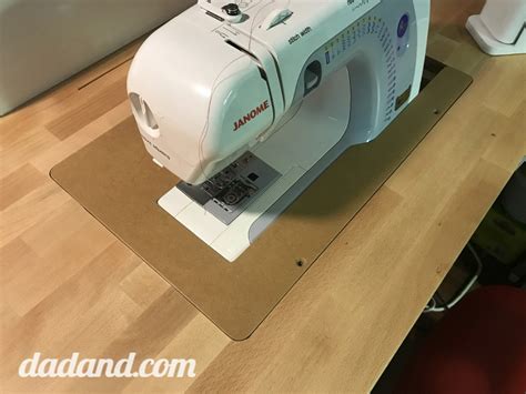A big drop in sewing machine table, a table for my laptop and printer, a cutting table with large storage underneath, an ironing table and a cabinet with lots of storage. DIY Sewing Machine Table | dadand.com
