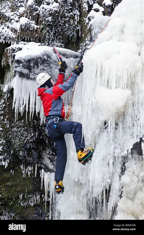 A Man Doing An Ice Climb On A Frozen Waterfall Lynn Falls In Lynn Glen