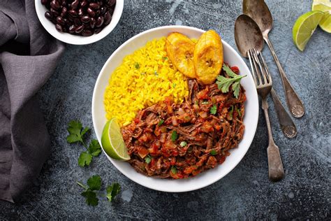Ropa Vieja Shredded Beef With Yellow Rice Pilaf And Plantains
