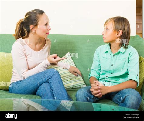 Serious Mother Scolding Teenage Son In Living Room Stock Photo Alamy