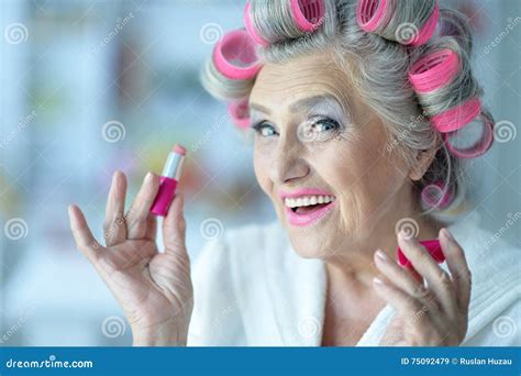 senior woman in hair rollers stock image image of person fashion 75092479