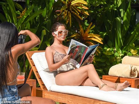 Demi Rose Oozes Sex Appeal In A Curve Hugging Snakeskin Print Swimsuit