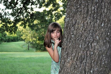Young Girl Hiding Behind Tree Free Stock Photo - Public ...