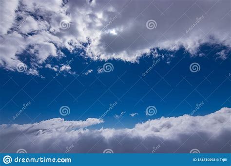 Some Fluffy White Clouds And Bright Blue Skies Stock Image Image Of