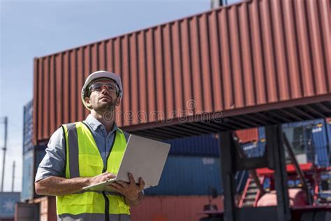 Logistics Engineer Control At The Port Loading Containers For Trucks