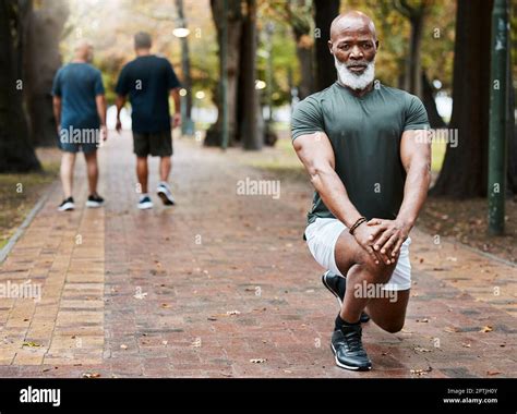 Senior African Man Stretching And Park With Focus For Fitness