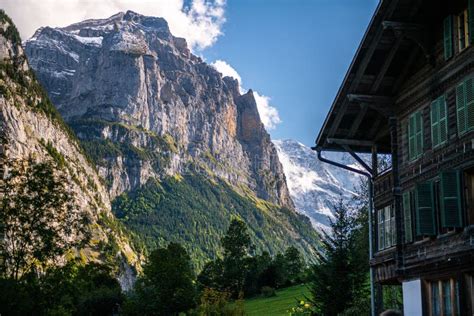 Majestic Rocky Cliff With Greenery On The Slope In Lauterbrunnen
