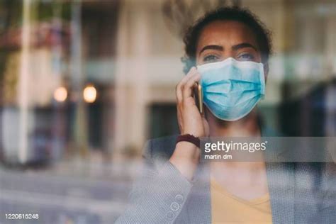 Black Woman On Phone With Mask Photos And Premium High Res Pictures Getty Images