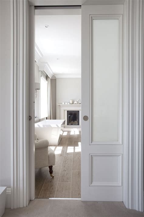 Holds 30 inch door inside wall, and 30 inches of closed door, plus adds for 3/4 jamb thickness and some door trim on pocket side. double sliding pocket doors into front sitting room ...