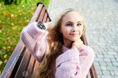 Pretty Teenage Girl 14 16 Year Old With Curly Long Blonde Hair In The