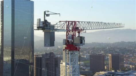 Aerial Close Up Of Construction Site Skyscraper Crane In Downtown Los