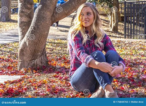 A Lovely Blonde Model Enjoys An Autumn Day Outdoors At The Park Stock Image Image Of Cute