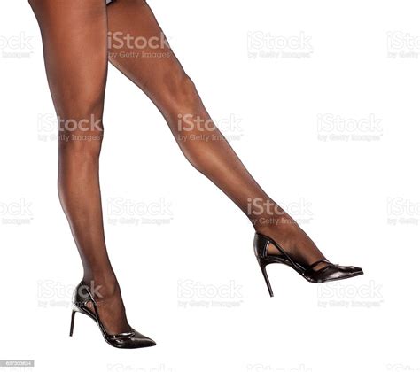 Pretty Nice Cared Feminine Legs In Nylon Stockings High Heels Stock
