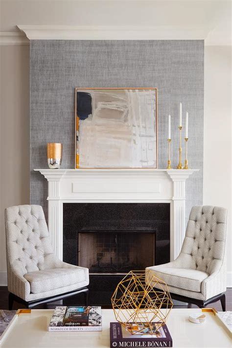 gray abstract art leaning  fireplace mantel