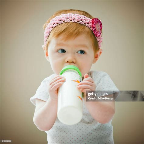 Caucasian Baby Girl Drinking Bottle High Res Stock Photo Getty Images